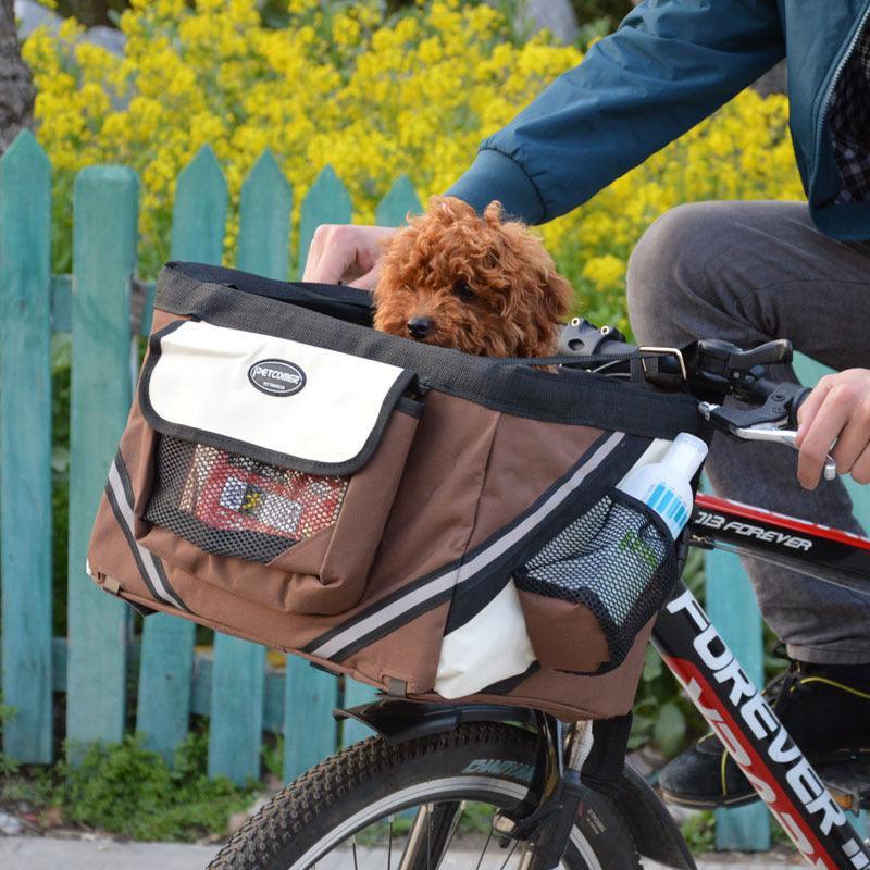 Dog Hugs Cat Bikepaws Pet Traveler removable front bicycle carrier for small cats and dogs, attached to a bicycle handlebars.